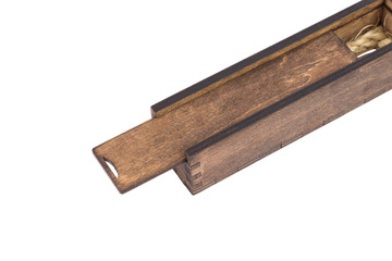 Beautiful wooden box with ballpoint pen inside on a white background.