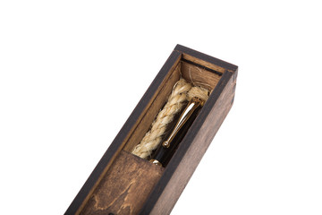 Beautiful wooden box with ballpoint pen inside on a white background.