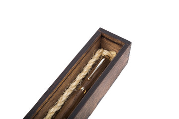 Beautiful wooden box with ballpoint pen inside on a white background.