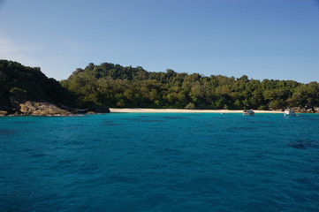 Fototapeta na wymiar A white strip of sand in a beach of the Similan Islands in Thailand