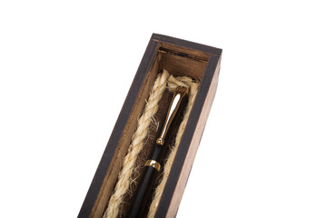 Beautiful wooden box with ballpoint pen inside on a white background.