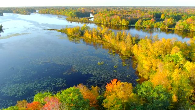 Scenic Autumn flight over the Menominee River, Fall colors. The Menominee River flows along the border of Wisconsin and Upper Michigan.