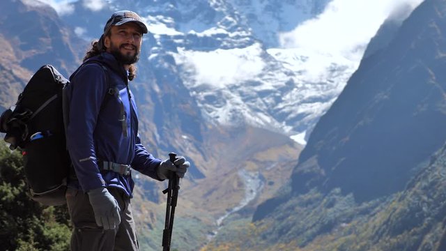 Active positive hiker smile to camera and says something. Static handled shot, Travel sport lifestyle concept