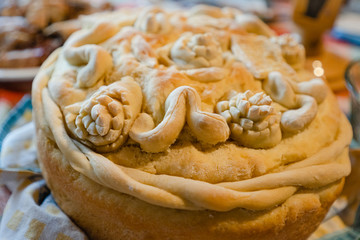 Close up view on traditional orthodox slava bread in Serbia for the saint day religion on the table at family home