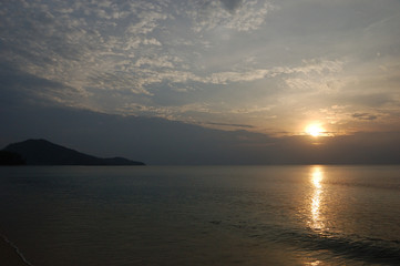 The sun going down at Nai Yang Beach, Phuket, Thailand