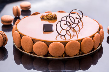 Macaron caramel french cake with chocolate decorations 