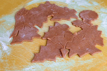 Christmas shaped gingerbread cookie from the raw dough before baking