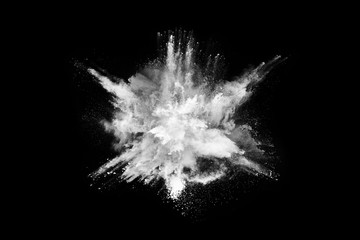 White powder explosion on black background. Colored cloud. Colorful dust explode. Paint Holi.