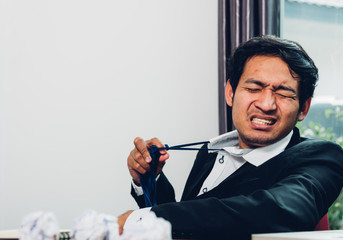Young asian business man manager frustrated he has tired