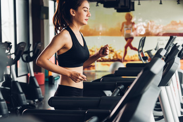 Beautiful woman active running exercise workout on treadmill