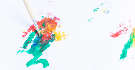 Happy asian baby child use paintbrush draw paint color
