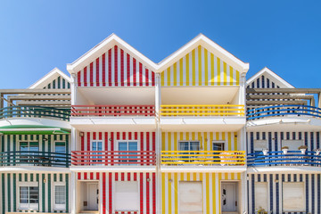 Street with colorful houses in Costa Nova, Aveiro, Portugal. Street with striped houses, Costa...