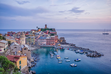 Sunset view of Vernazza village port in Cinque Terre, Italy