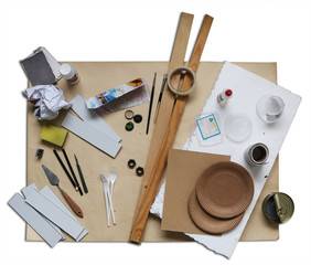 Recycling materials and tools to make homemade crafts over white background