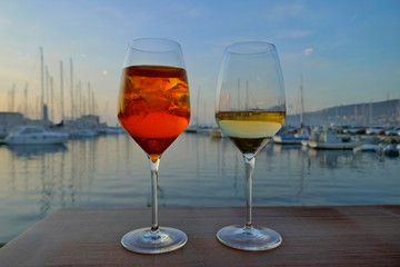 Waiting for the sunset while enjoying an aperitif.  A pleasant evening in Italy   