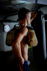 Fototapeta na wymiar Fitness man standing over dark background