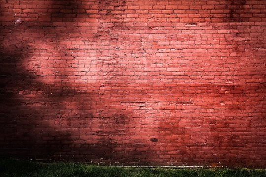 Old red painted brick wall background