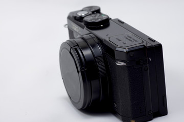 Fototapeta premium Black vintage style camera on a white isolated background