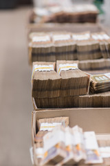 Large sum of money placed in boxes at the center of cash services
