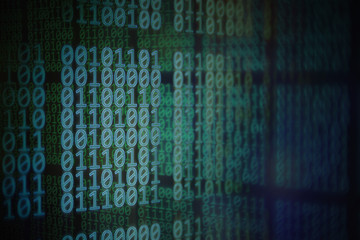 double exposure image of display showing blocks of red binary code language over blue green blocks....