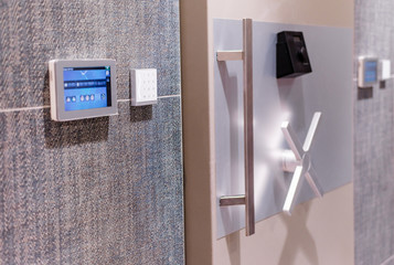 Large safe door with numeric keypad and touchscreen