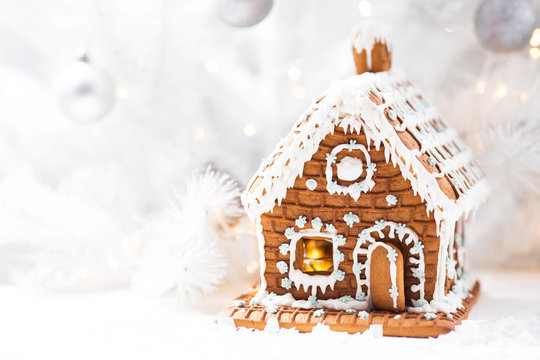 Homemade Gingerbread House, White Christmas Tree And Garland Light.