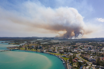 the town of Tuncurry on the new south wales north coast drone with bush fire out of control in...
