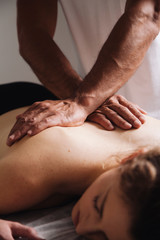 Obraz na płótnie Canvas Reiki session alternative therapies. Hands transmitting energy on the back