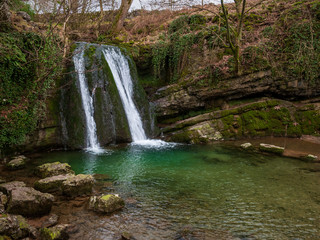 Fototapeta premium Janet's Fosses waterfall into a green gorge