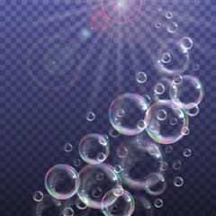 Realistic floating soap bubbles with rainbow reflection on transparent background. Design element for advertising booklet, flyer or poster