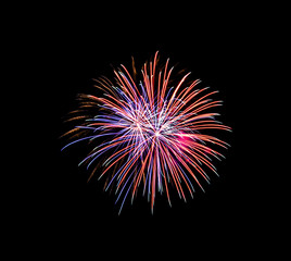 Beautiful colorful fireworks exploding in the night sky, isolated on black background