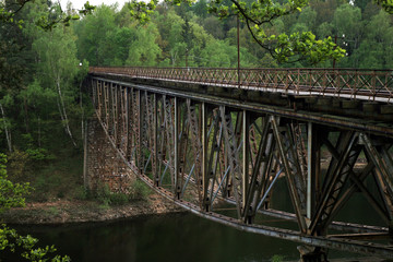Train track on the historic iron railway bridge - Pilchowice Lake - Lower Silesia, Poland. industrial abstraction.