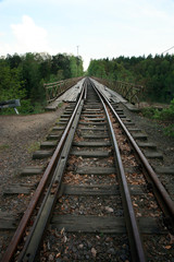 Fototapeta na wymiar Train track on the historic iron railway bridge - Pilchowice Lake - Lower Silesia, Poland. industrial abstraction.