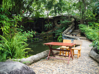 Table and seat in the middle of restaurant that decorate environment as the forest, Rayong Thailand