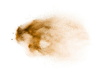 Freeze motion of brown powder exploding. Abstract design of brown dust cloud against white background.