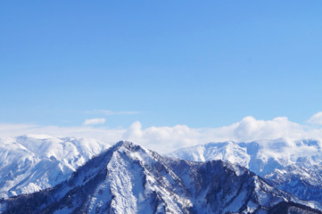 mountains in winter and blue sky