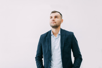 Success and luck in work, respect. Portrait of a young successful man with emotions.