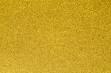 Golden metallic abstract texture for Christmas and festive design.