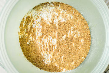 White flour with bread crumbs in deep bowl for roasting meat and fish.