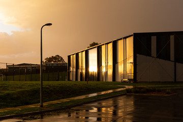 Storage warehouse illuminated in golden hour sun light.
