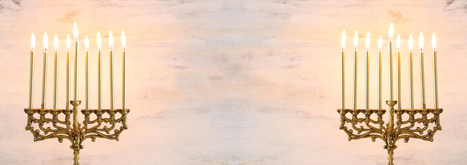 Religion image of jewish holiday Hanukkah background with menorah (traditional candelabra) and candles