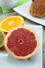 Fototapeta na wymiar citrus fruits, oranges, grapefruit and lemon on a table