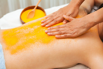.Asian woman getting a salt scrub on her back beauty treatment in the health spa - 300072688