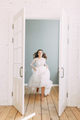 Beautiful girl in white dress, European wedding. Air and light photo shoot of the bride.