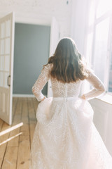 Beautiful girl in white dress, European wedding. Air and light photo shoot of the bride.