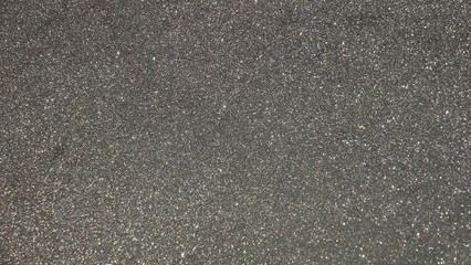 Black gray glitter background texture. Element of design.