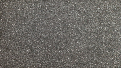 Black gray glitter background texture. Element of design.