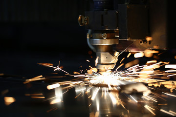 Sparks fly out machine head for metal processing