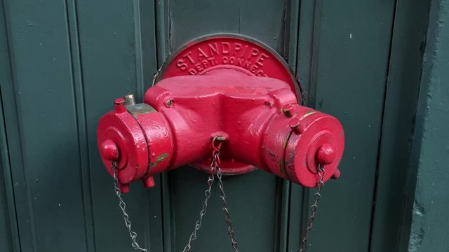 Fire red Standpipe in a New York city.