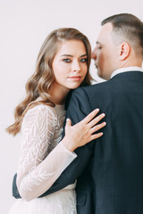 Stylish ceremony in European style. Beautiful couple in the interior Studio.